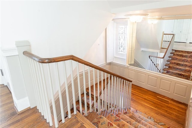 staircase featuring hardwood / wood-style flooring