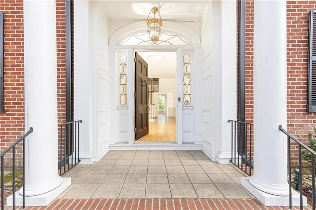 entryway with light tile patterned floors