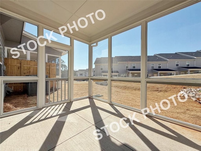 sunroom featuring a residential view