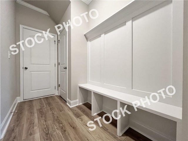 mudroom with baseboards and wood finished floors