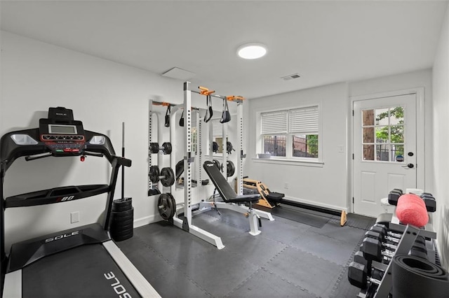 exercise room with baseboards