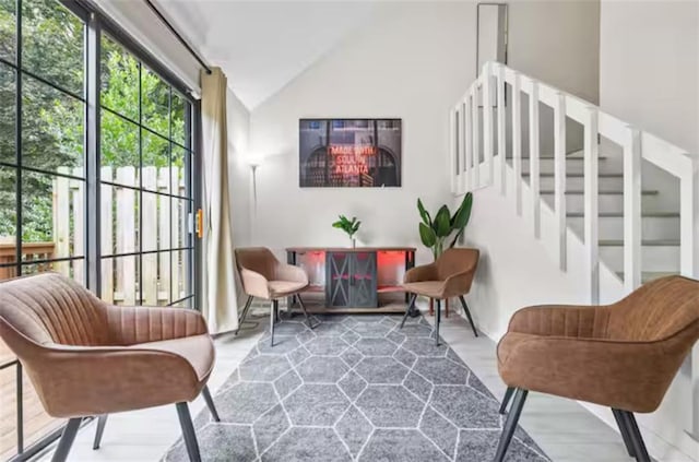 living area with lofted ceiling