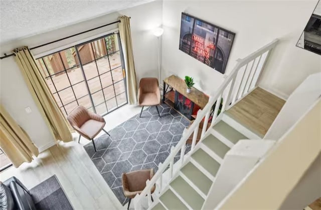 interior space with hardwood / wood-style flooring and a textured ceiling