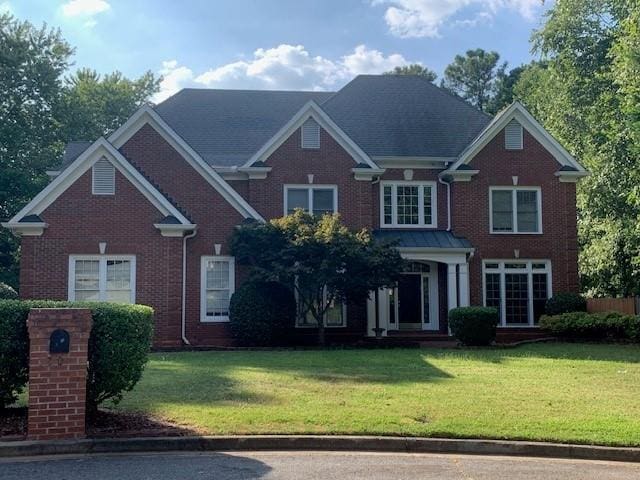 view of front of home with a front yard