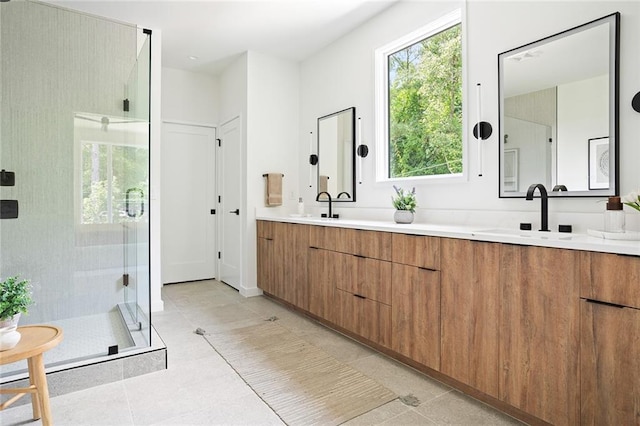 3117 Robinson Ave, Scottdale, GA 30079 - bathroom with double vanity, a shower stall, and tile patterned floors