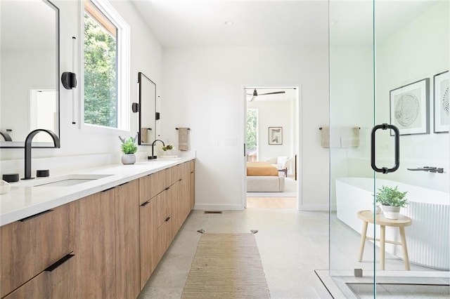 3117 Robinson Ave, Scottdale, GA 30079 - full bathroom featuring double vanity, healthy amount of natural light, a freestanding bath, and ensuite bath