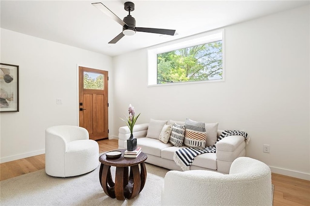 3117 Robinson Ave, Scottdale, GA 30079 - living room with light wood-type flooring, baseboards, and a ceiling fan