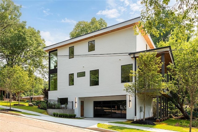 3117 Robinson Ave, Scottdale, GA 30079 - view of side of property featuring a garage and concrete driveway