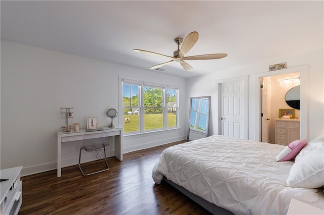 bedroom featuring a ceiling fan, ensuite bath, wood finished floors, and baseboards