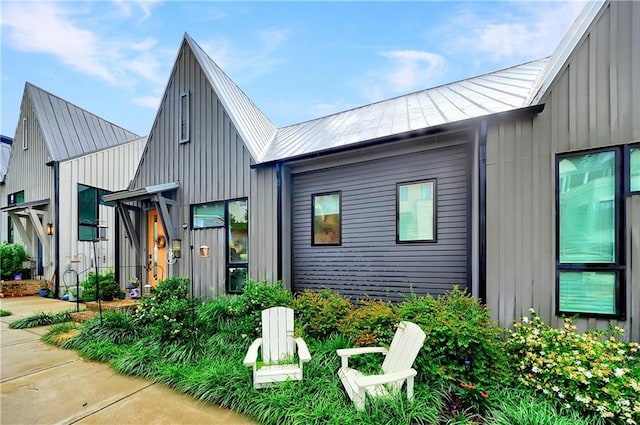 10862 Serenbe Ln, Chattahoochee Hills, GA 30268 - modern farmhouse style home featuring board and batten siding and a metal roof