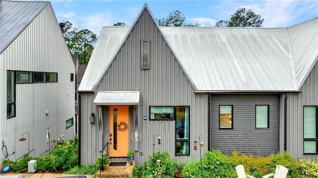 10862 Serenbe Ln, Chattahoochee Hills, GA 30268 - view of front facade with a metal roof and board and batten siding