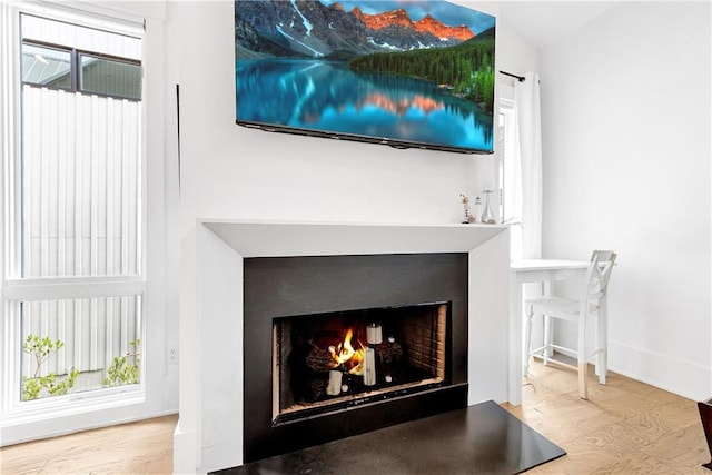 10862 Serenbe Ln, Chattahoochee Hills, GA 30268 - detailed view of a warm lit fireplace and baseboards