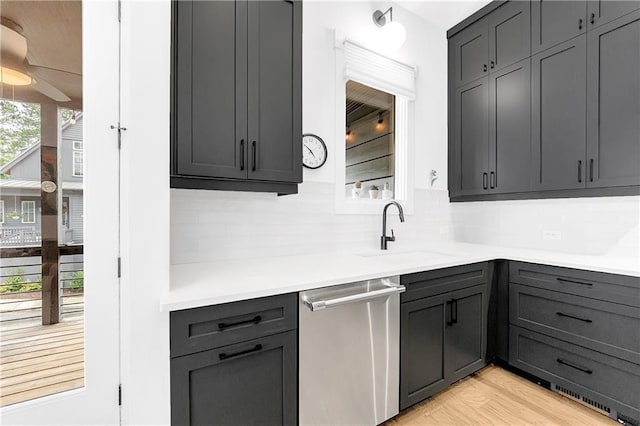 10862 Serenbe Ln, Chattahoochee Hills, GA 30268 - kitchen with stainless steel dishwasher, tasteful backsplash, light countertops, gray cabinets, and ceiling fan