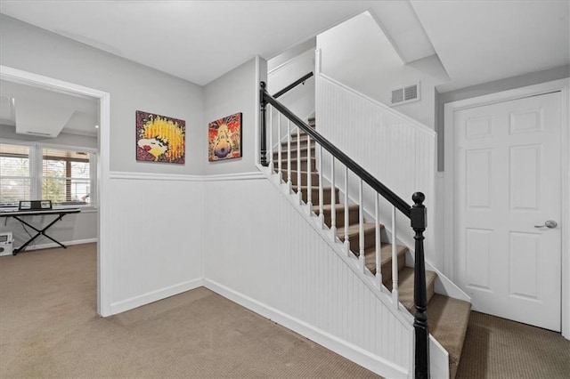 staircase with carpet flooring