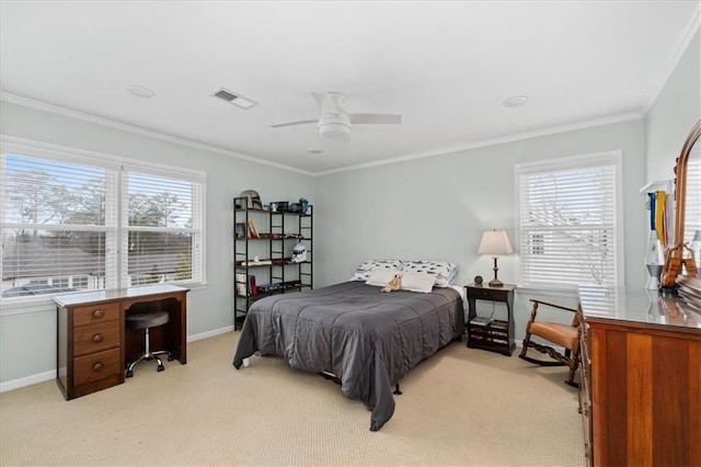 carpeted bedroom featuring ceiling fan and ornamental molding