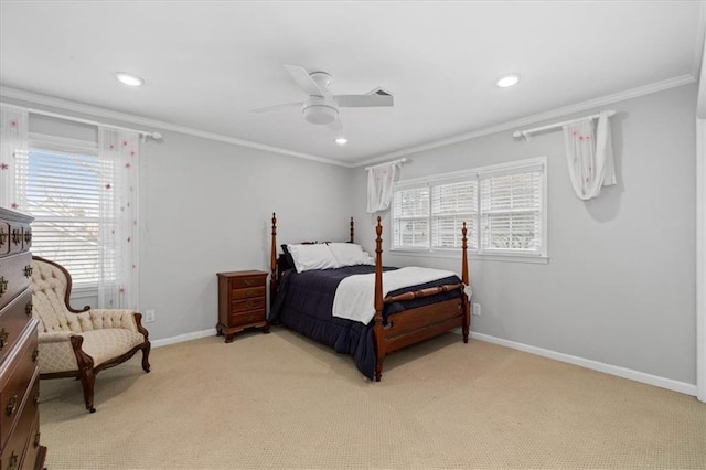 bedroom featuring light carpet, ornamental molding, and ceiling fan