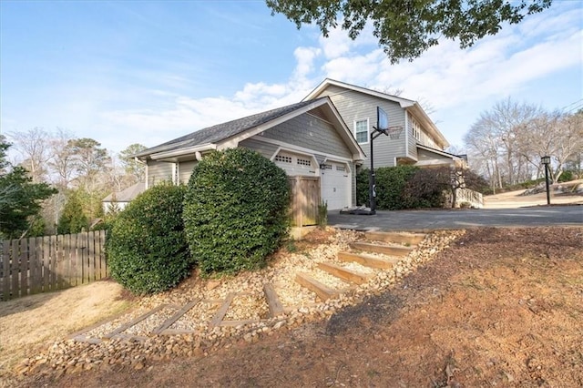 view of side of home with a garage