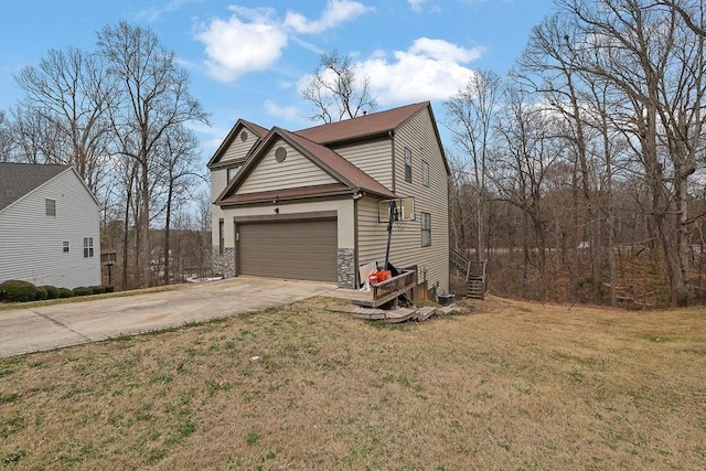 view of front of house featuring a garage, driveway, stone siding, and a front yard