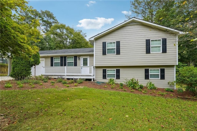 tri-level home with a front lawn