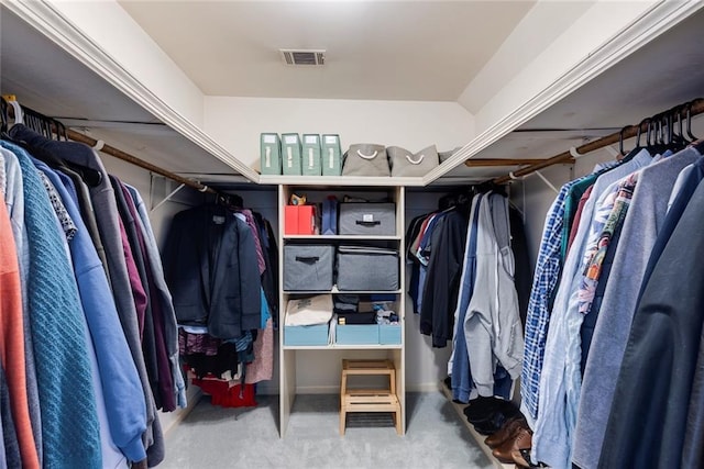 spacious closet with visible vents and carpet floors