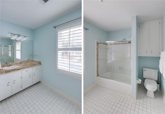 full bathroom with vanity, toilet, baseboards, and combined bath / shower with glass door