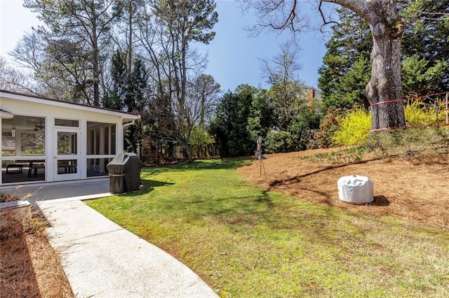 view of yard with a sunroom