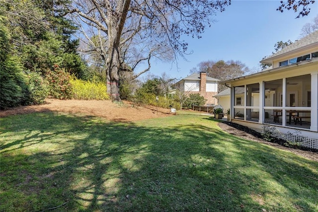 view of yard with a sunroom