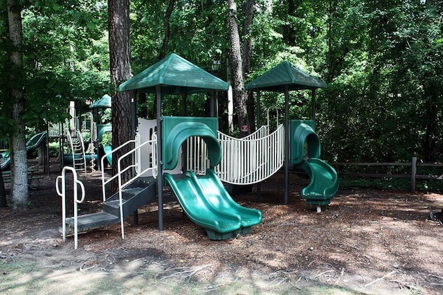 communal playground featuring fence