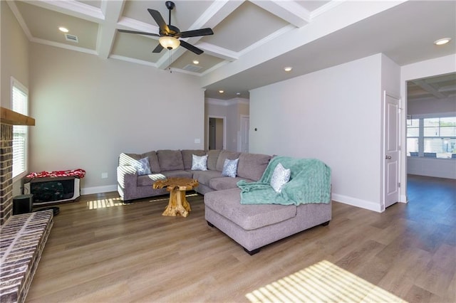 living room with beam ceiling, hardwood / wood-style floors, and coffered ceiling