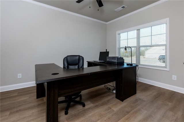 home office with ceiling fan, wood-type flooring, and ornamental molding
