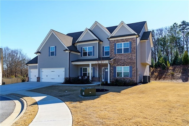 view of front facade featuring cooling unit, a garage, and a front yard