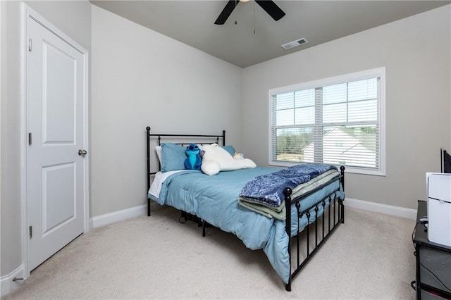 carpeted bedroom featuring ceiling fan