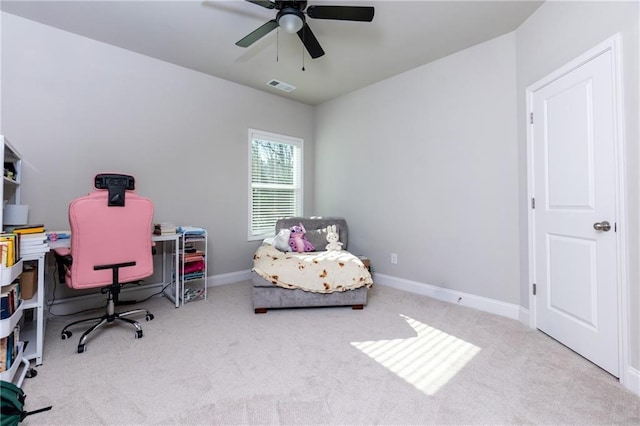 home office with light carpet and ceiling fan