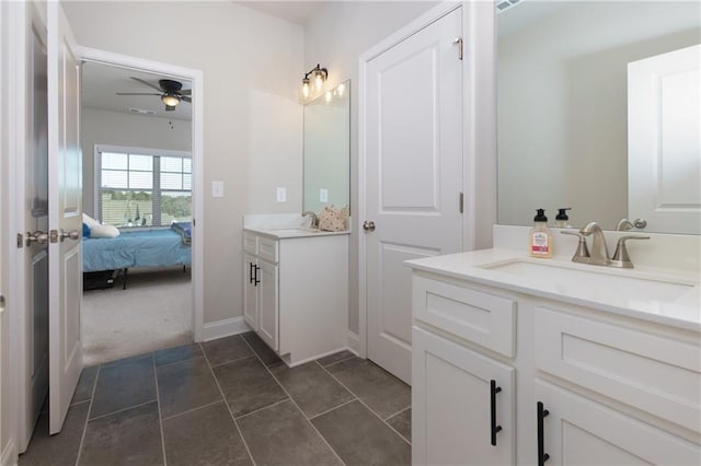 bathroom with ceiling fan and vanity
