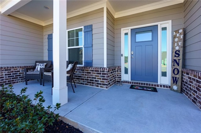 doorway to property with covered porch