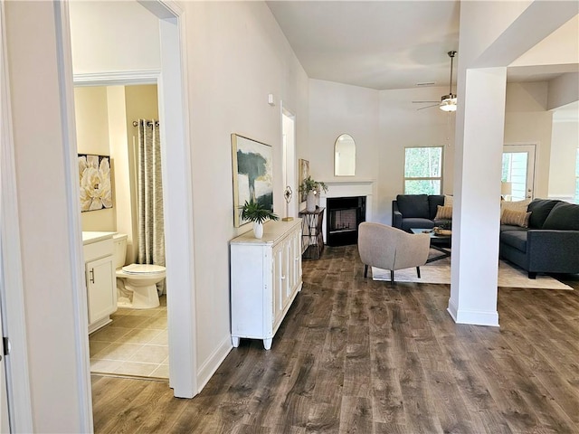 hallway with dark hardwood / wood-style floors