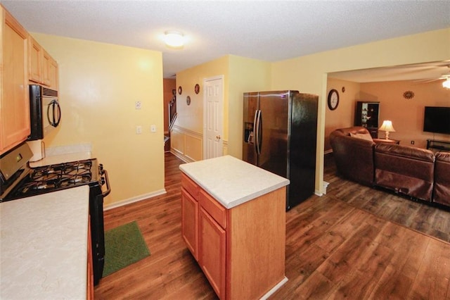 1801 Deer Crossing Cir, Jonesboro, GA 30236 - kitchen with stainless steel refrigerator with ice dispenser, gas stove, black microwave, and dark wood-type flooring
