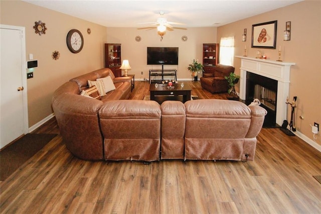 1801 Deer Crossing Cir, Jonesboro, GA 30236 - living area with a ceiling fan, wood finished floors, a fireplace, and baseboards