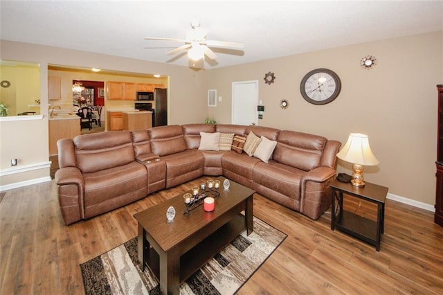 1801 Deer Crossing Cir, Jonesboro, GA 30236 - living area featuring ceiling fan, light wood-style flooring, and baseboards