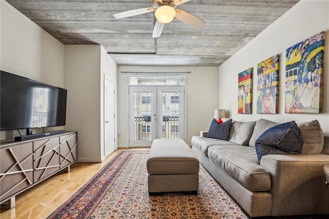 800 Peachtree St NE Unit 2304, Atlanta, GA 30308 - living area featuring wood finished floors, ceiling fan, and french doors