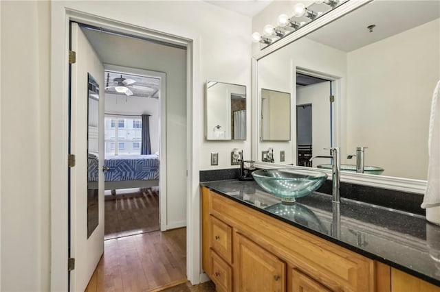 800 Peachtree St NE Unit 2304, Atlanta, GA 30308 - bathroom with hardwood / wood-style floors, vanity, and ensuite bathroom