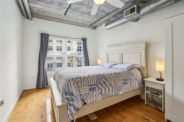 800 Peachtree St NE Unit 2304, Atlanta, GA 30308 - bedroom featuring wood finished floors, baseboards, and a ceiling fan