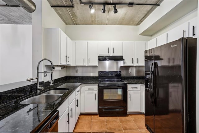 800 Peachtree St NE Unit 2304, Atlanta, GA 30308 - kitchen with black appliances, a sink, under cabinet range hood, dark stone countertops, and white cabinetry