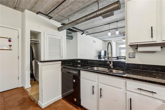 800 Peachtree St NE Unit 2304, Atlanta, GA 30308 - kitchen featuring dishwasher, a sink, tile patterned floors, white cabinets, and dark stone countertops