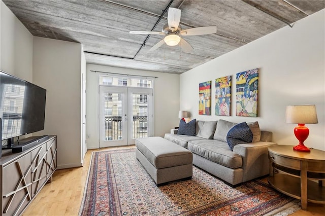 800 Peachtree St NE Unit 2304, Atlanta, GA 30308 - living area with light wood finished floors, a ceiling fan, and french doors