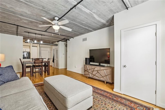 800 Peachtree St NE Unit 2304, Atlanta, GA 30308 - living room featuring a ceiling fan and wood finished floors