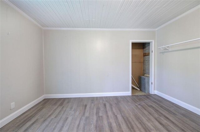 2014 Maple Ave SW, Rome, GA 30161 - unfurnished bedroom with ornamental molding, baseboards, and wood finished floors