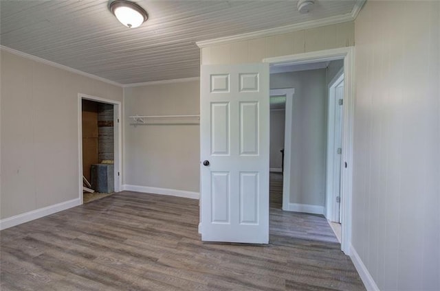 2014 Maple Ave SW, Rome, GA 30161 - unfurnished bedroom with wood finished floors, ornamental molding, baseboards, and a closet