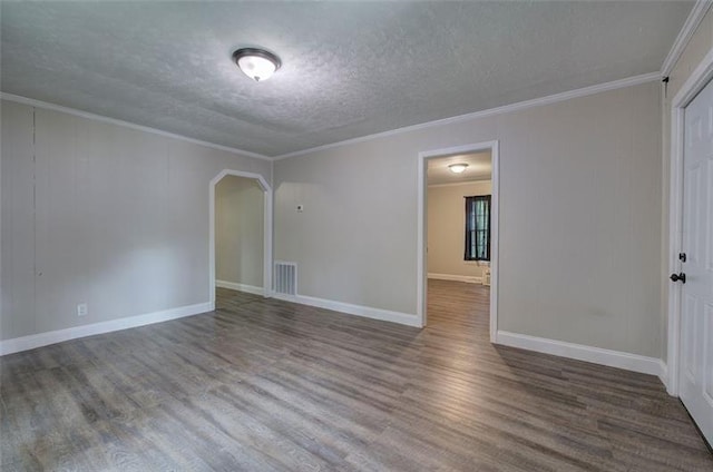 2014 Maple Ave SW, Rome, GA 30161 - empty room with wood finished floors, a textured ceiling, arched walkways, crown molding, and baseboards