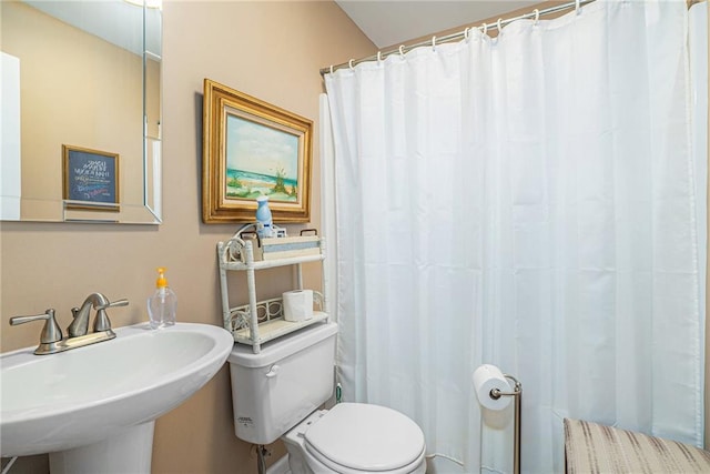 bathroom featuring toilet and sink